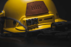 3 slot  Mapul Picatinny Rail adapter on a yellow kevy hard hat.